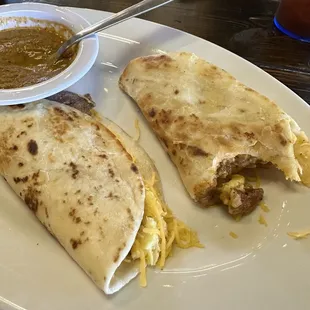 Breakfast tacos with ranchero sauce.