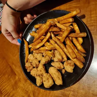 a plate of fried chicken and fries