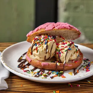 two donuts with ice cream and sprinkles