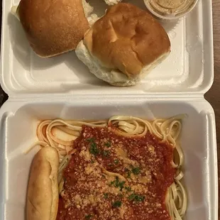Spaghetti marinara, bread stick, rolls, honey butter.