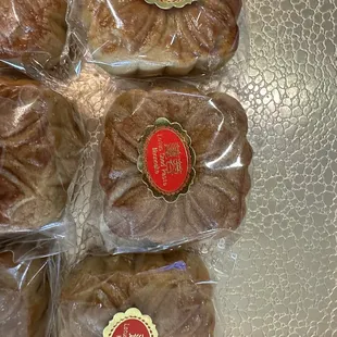six buns wrapped in plastic wrap