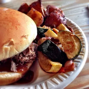 Sliced brisket sandwich with the spicy BBQ sauce, potatoes au gratin and seasoned vegetables (also wonderfully spicy). Amazing!