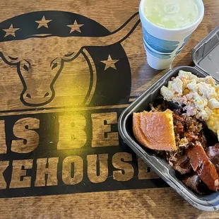 Two meat plate with Beef Brisket, Pulled Pork, Mac &amp; Cheese, Barrel Baked Potatoes, Cornbread, &amp; a medium drink.