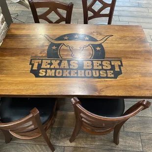 Tables have the logo emblazoned upon them.