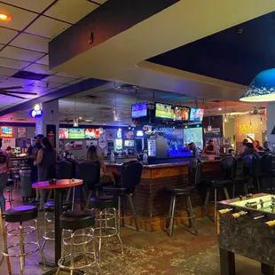 Shot of the bar area from nearby the pool tables