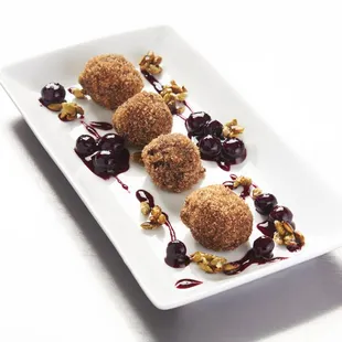 Chocolate and Sugar Donuts with Blueberry Sauce