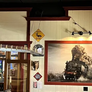 Train tracks from dining room through the bar section.