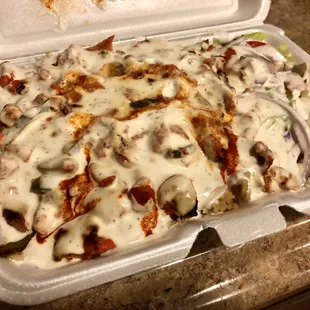 Chicken over rice w. salad, extra white &amp; hot sauces ($7)! Delicious!!