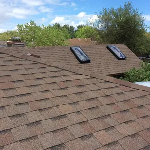 New re-roof with skylight installation