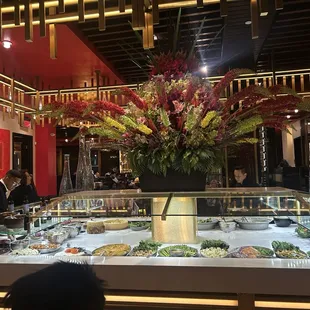 Main buffet area with flower arrangement