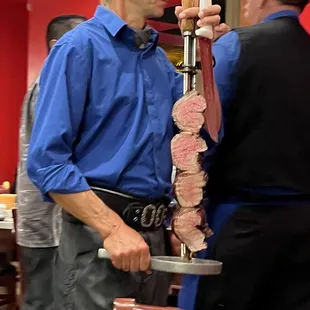 Staff walk around with different meats allowing you pick and choose what you want.