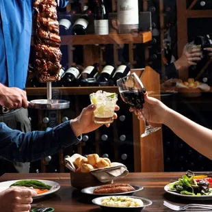 a group of people toasting at a restaurant