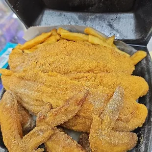 2 fillets, fries, 4 whole wings and 2 pieces of bread and a slice of red velvet cake $19.47