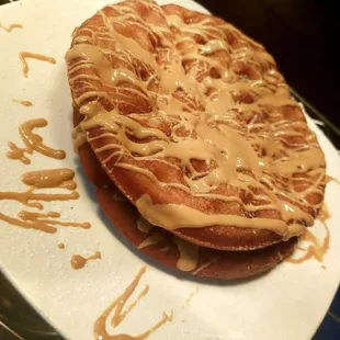 Deep fried waffles, add melted peanut butter that you see drizzled on there, and a little powdered sugar!