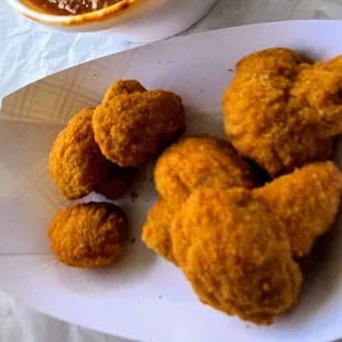 a bowl of chili and fried chicken