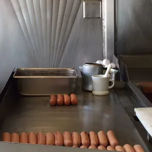 hot dogs on a conveyor belt