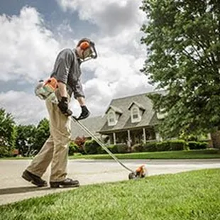 a man mowing the lawn