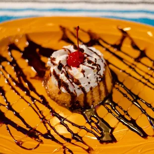 a desert on a yellow plate