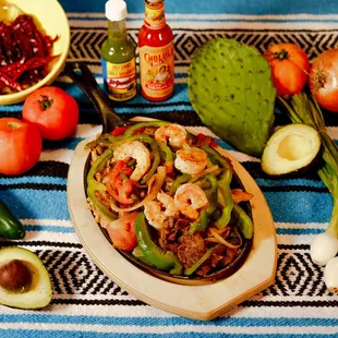 a plate of shrimp and peppers