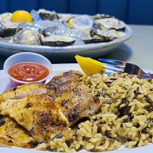Blackened catfish fillet and a dozen of fresh oysters.