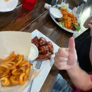 a child giving a thumbs up