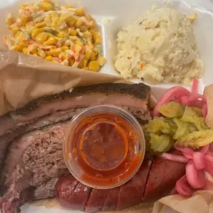 Sausage and Brisket plate with corn salad &amp; potato salad