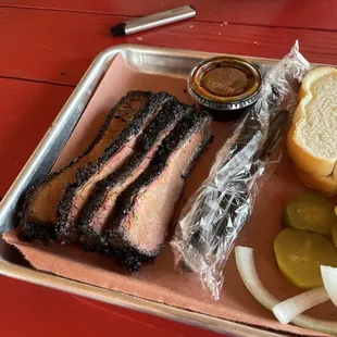 a tray of meat and pickles