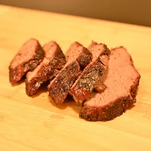 liced pork on a cutting board