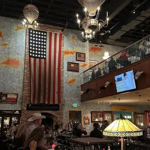 a view of a bar with a flag hanging from the ceiling