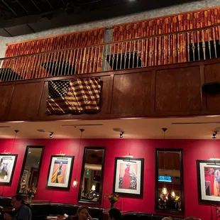 a view of a restaurant with red walls