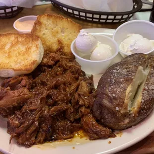 Pulled Pork Dinner with Baked Potato. Other side was the Caesar Salad.