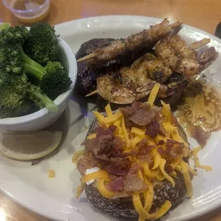 Dallas 8oz filet, shrimp skewers, broccoli and loaded baked potato