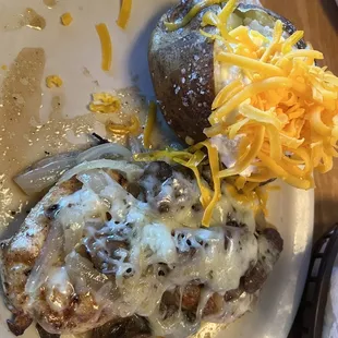 Smothered Chicken and loaded baked potato
