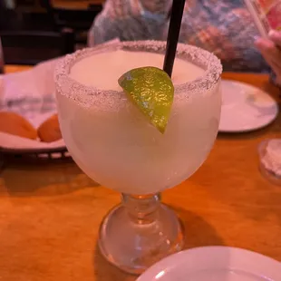 a margarita with a lime slice on the rim