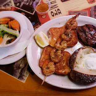 My meal, sirloin steak, baked potato, vegetables grilled shrimp
