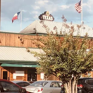 cars parked in front of the restaurant