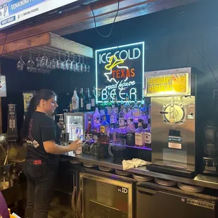 a bartender at the bar