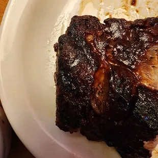 a half eaten steak on a plate