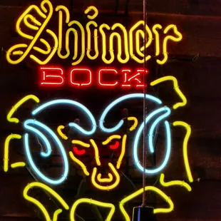 a neon sign for a bar
