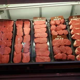 a display of meat in a case