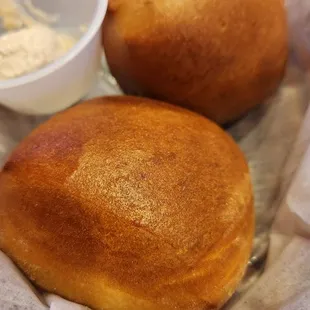 Hot delicious rolls served with honey and cinnamon butter.