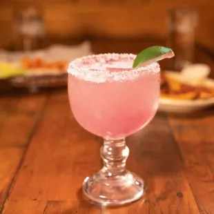 a margarita with a lime garnish