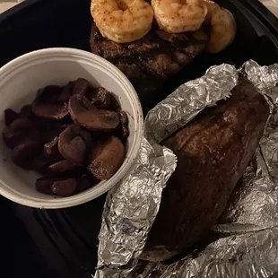 8 oz filet with 3 grilled shrimp, sautéed mushrooms, baked potato.