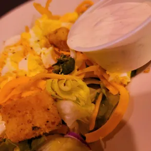 a closeup of a salad with dressing