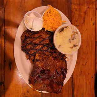 a plate of meat and sides