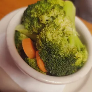 a bowl of broccoli and carrots