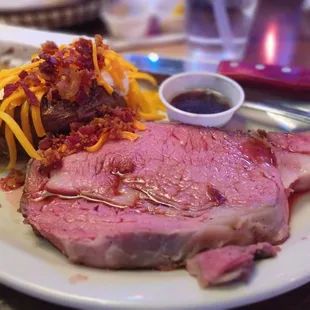 a plate of meat and pasta