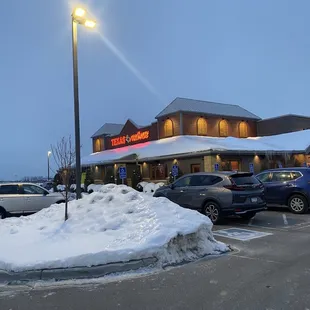 a parking lot with cars parked in front of it