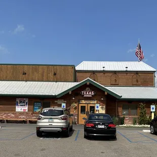 cars parked in front of the restaurant