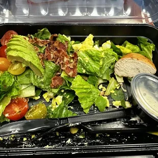 Partially eaten smoked chicken cob salad